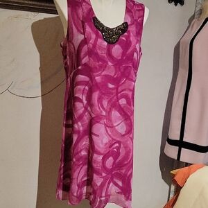 Vibrant Pink Sleeveless Dress with Statement Necklace